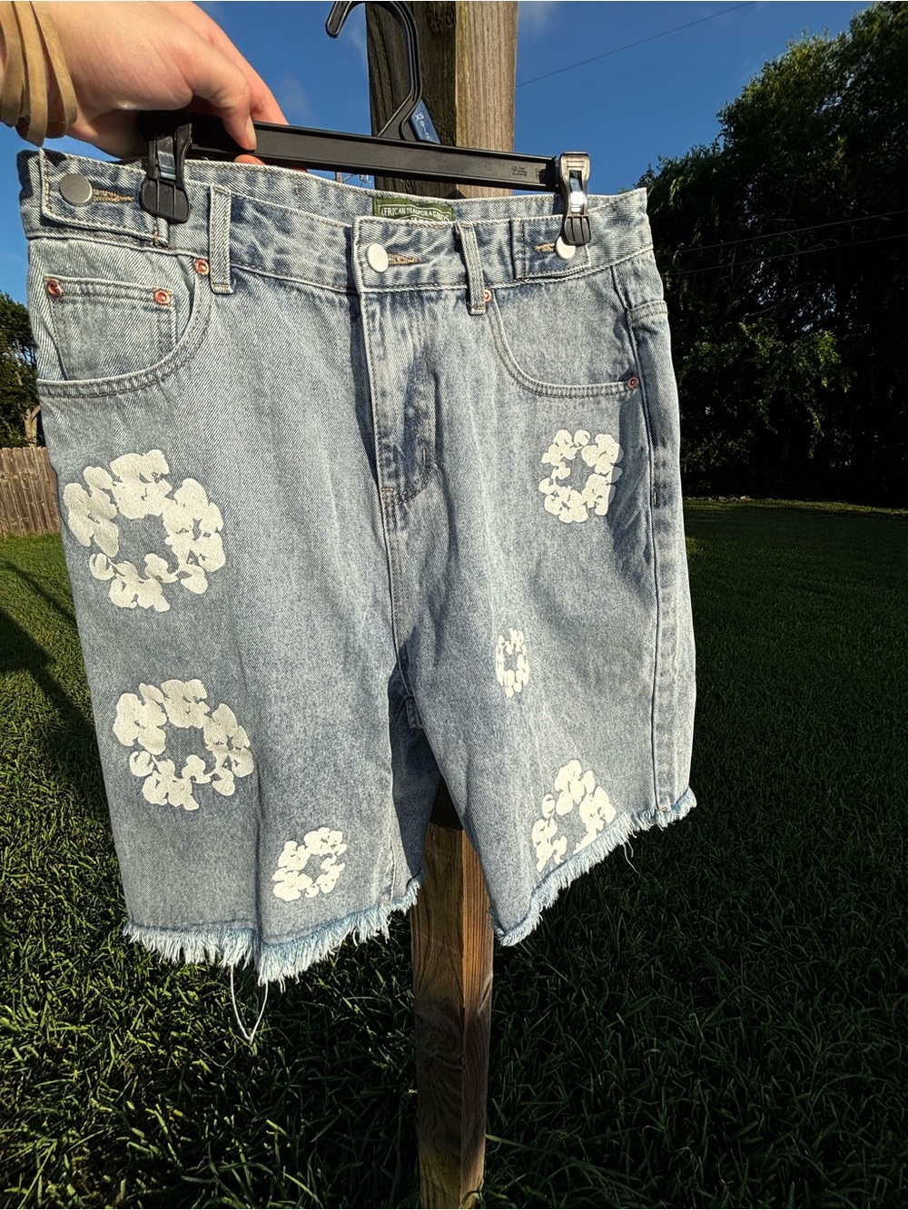 Denim Tears Light Wash Denim Shorts with White Floral Appliqué
